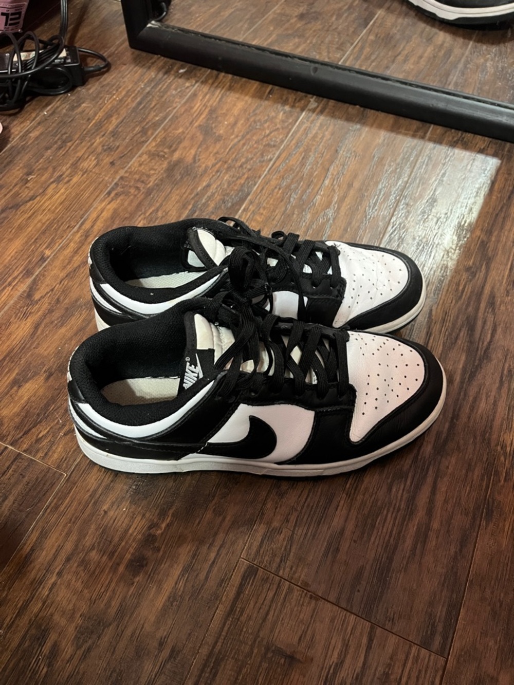 Nike Black and White Low-Top Swoosh Sneakers. They are a bit creased.